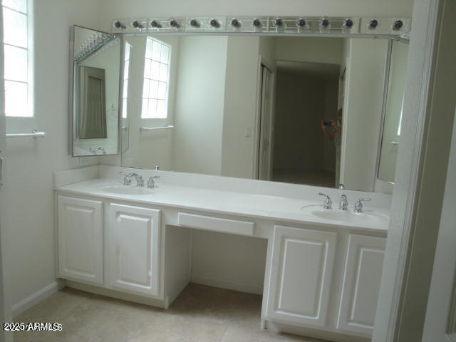 7461 West Matilda Lane Glendale, AZ 85308 - Photo 13 of 18 a bathroom with a double vanity sink a mirror and a shower