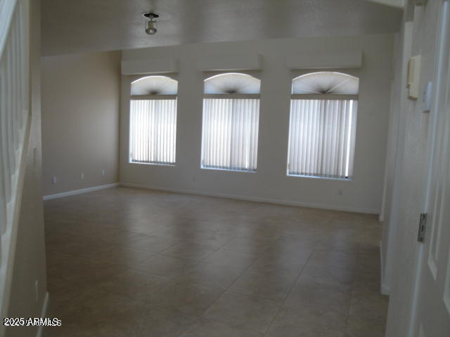 7461 West Matilda Lane Glendale, AZ 85308 - Photo 3 of 18 an empty room with windows and bathroom