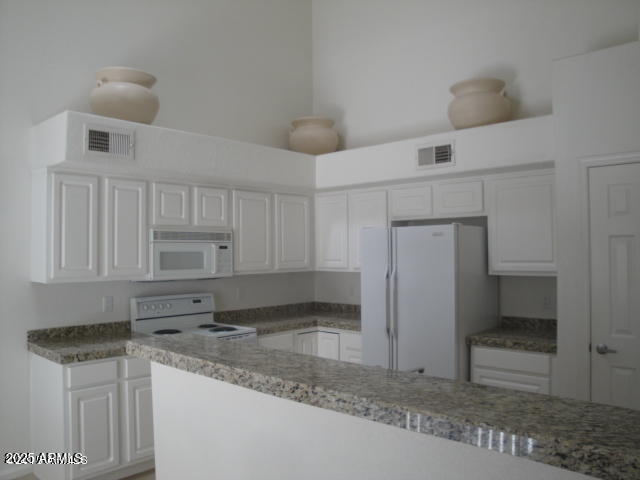 7461 West Matilda Lane Glendale, AZ 85308 - Photo 5 of 18 a kitchen with stainless steel appliances granite countertop a sink and cabinets