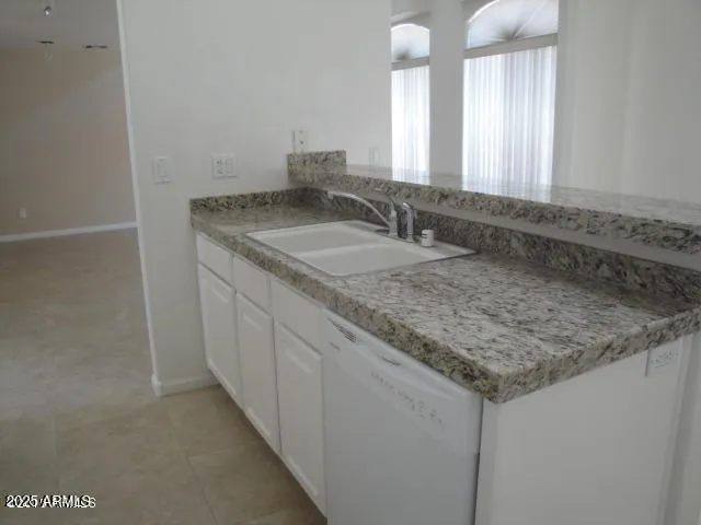 a kitchen with a refrigerator and a stove