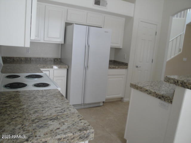7461 West Matilda Lane Glendale, AZ 85308 - Photo 7 of 18 a kitchen with a refrigerator and a stove