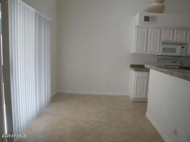 7461 West Matilda Lane Glendale, AZ 85308 - Photo 10 of 18 a kitchen with granite countertop white cabinets and a sink