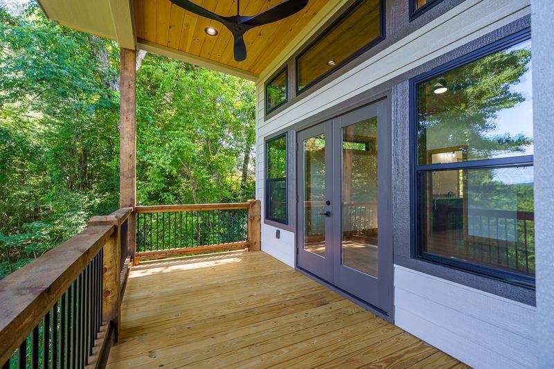 216 Old Orchard Road Ellijay, GA 30536 - Photo 17 of 59 a balcony with trees in front of it