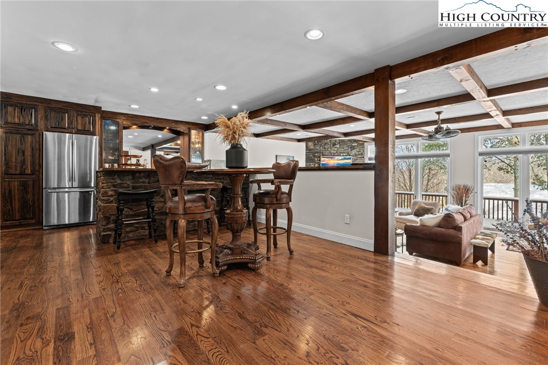 123 St Andrews Road Beech Mountain, NC 28604 - Photo 21 of 50 a view of a dining room with furniture window and wooden floor