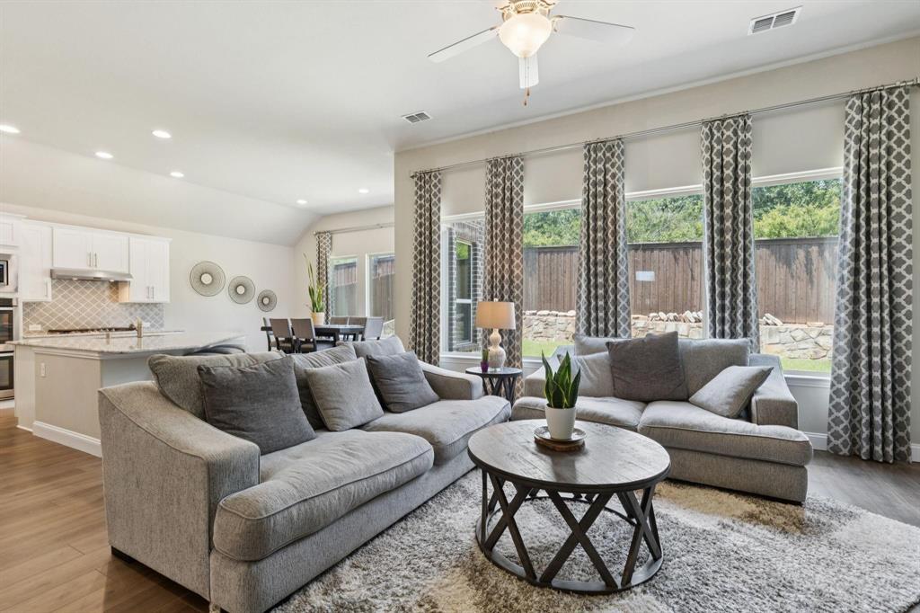 2121 Demarsh Lane Corinth, TX 76210 - Photo 11 of 39 a living room with furniture and a large window