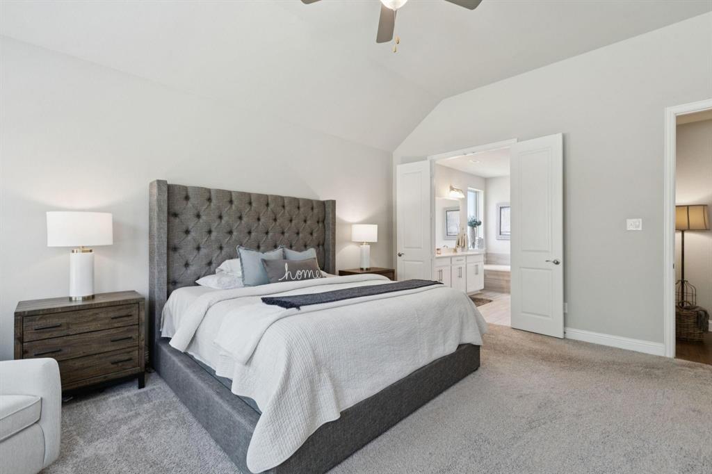 2121 Demarsh Lane Corinth, TX 76210 - Photo 16 of 39 a bedroom with a bed and a night stand