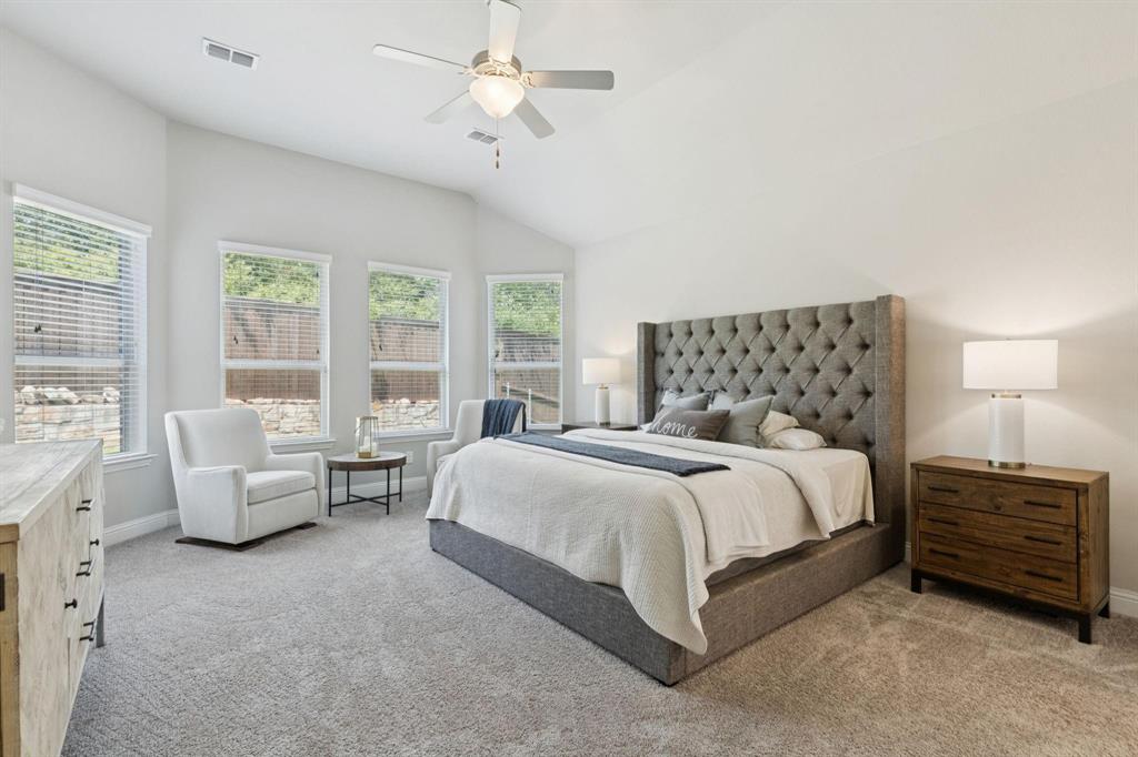 2121 Demarsh Lane Corinth, TX 76210 - Photo 18 of 39 a bedroom with a bed and a couch