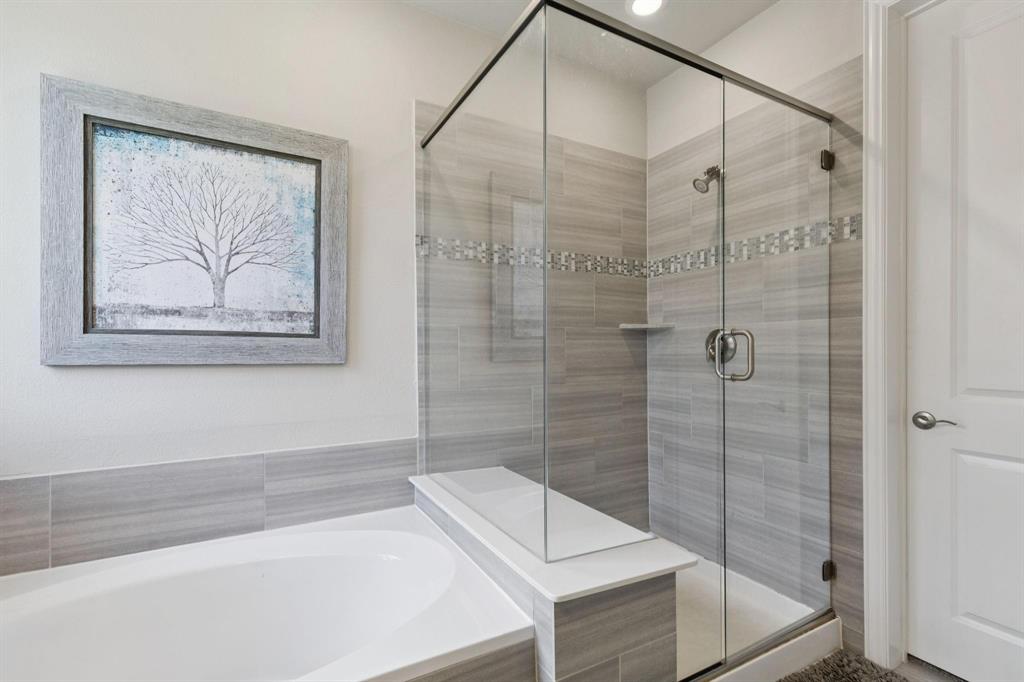 2121 Demarsh Lane Corinth, TX 76210 - Photo 19 of 39 a bathroom with a shower and a sink