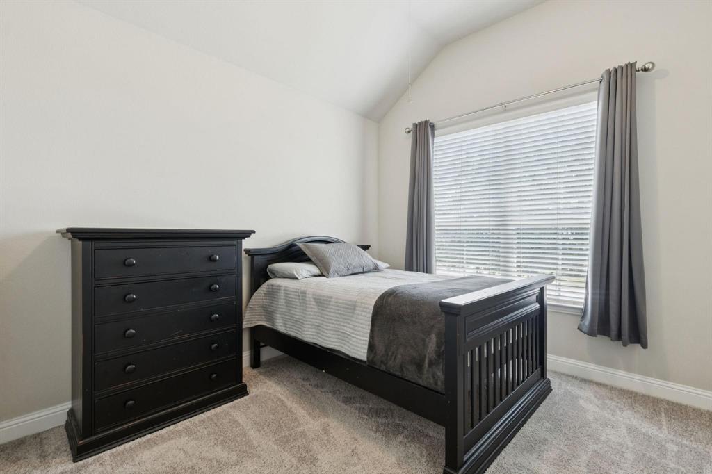 2121 Demarsh Lane Corinth, TX 76210 - Photo 28 of 39 a bedroom with a bed and a window