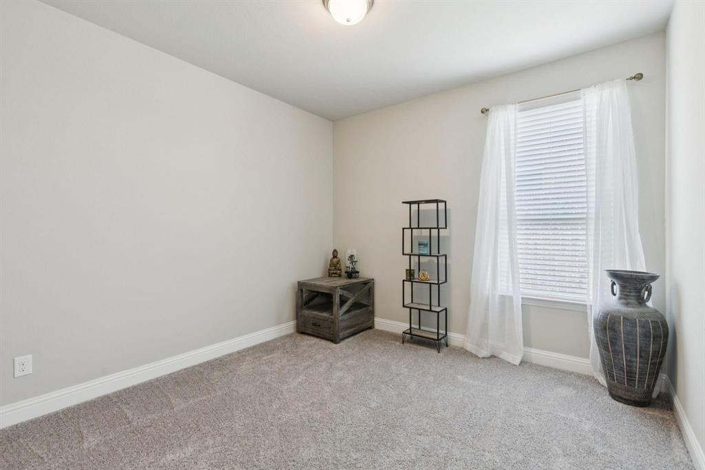 2121 Demarsh Lane Corinth, TX 76210 - Photo 30 of 39 an empty room with furniture and windows