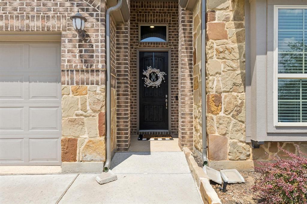 2121 Demarsh Lane Corinth, TX 76210 - Photo 3 of 39 a front view of a building
