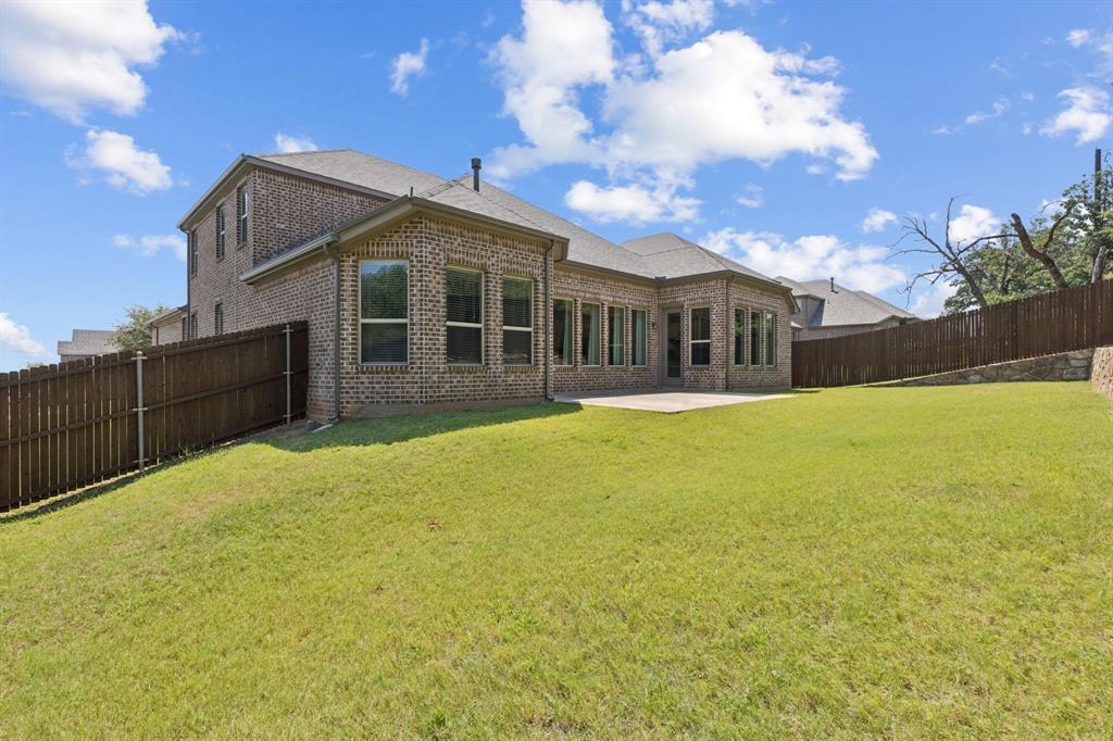 2121 Demarsh Lane Corinth, TX 76210 - Photo 35 of 39 a view of a house with a yard and roof