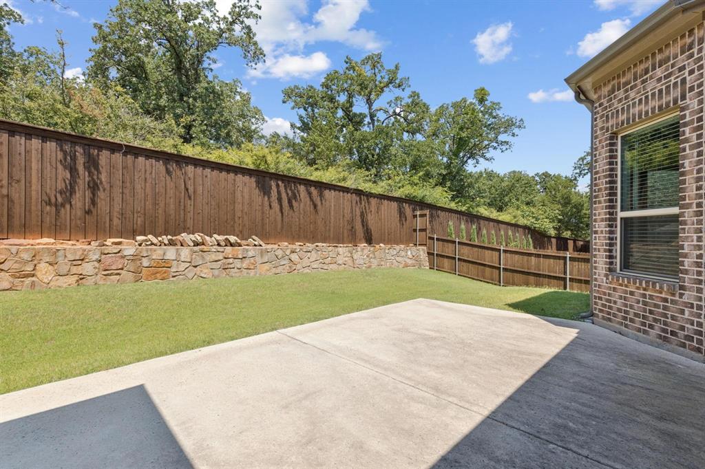 2121 Demarsh Lane Corinth, TX 76210 - Photo 36 of 39 a view of backyard with wooden fence