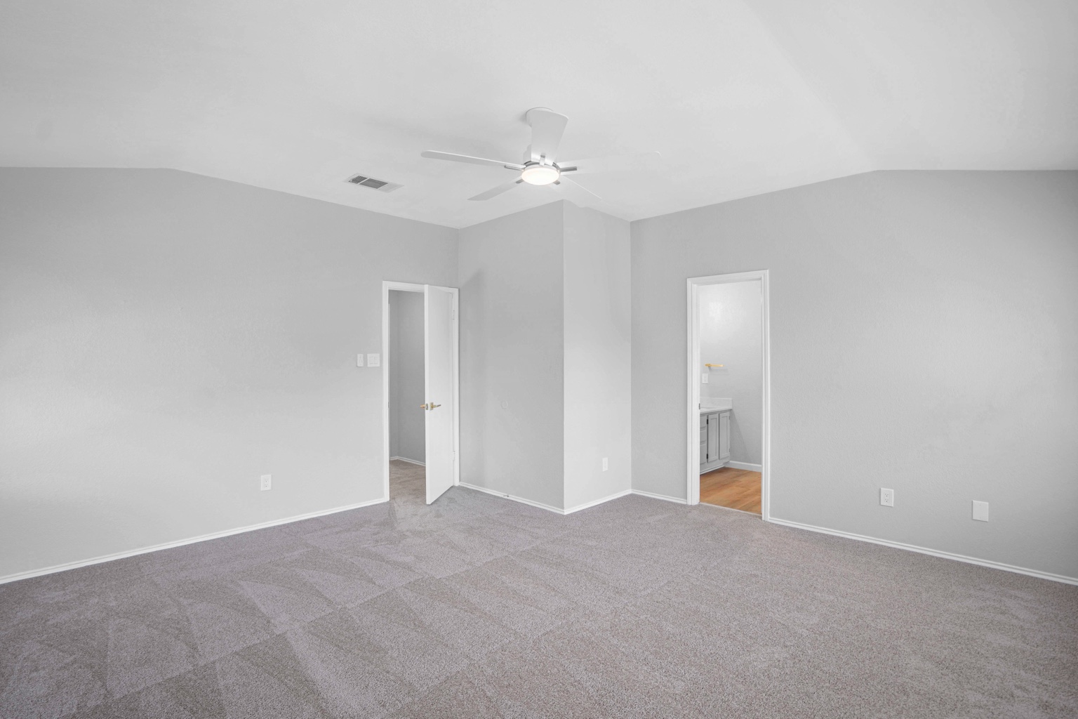 800 Smoke Signal Pass Pflugerville, TX 78660 - Photo 14 of 40 A spacious bedroom offers comfort and a tranquil atmosphere for relaxation.
