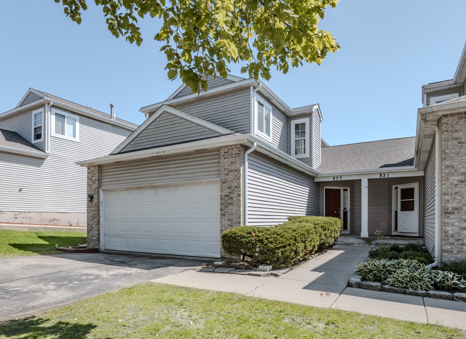 823 Park Bluff Circle Elgin, IL 60120 - Photo 18 of 20 a front view of a house with garden