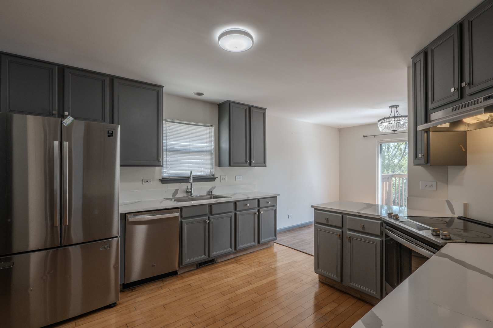 823 Park Bluff Circle Elgin, IL 60120 - Photo 2 of 20 a kitchen with stainless steel appliances granite countertop a sink stove and refrigerator