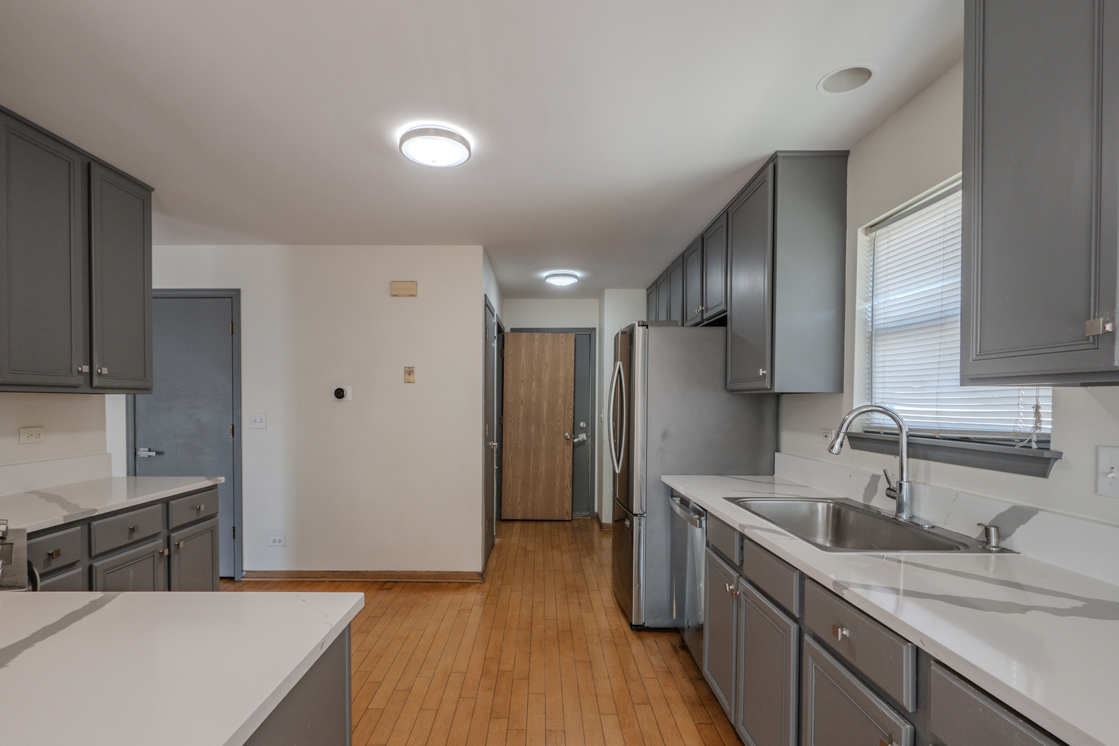 823 Park Bluff Circle Elgin, IL 60120 - Photo 3 of 20 a kitchen with stainless steel appliances granite countertop a sink stove and refrigerator