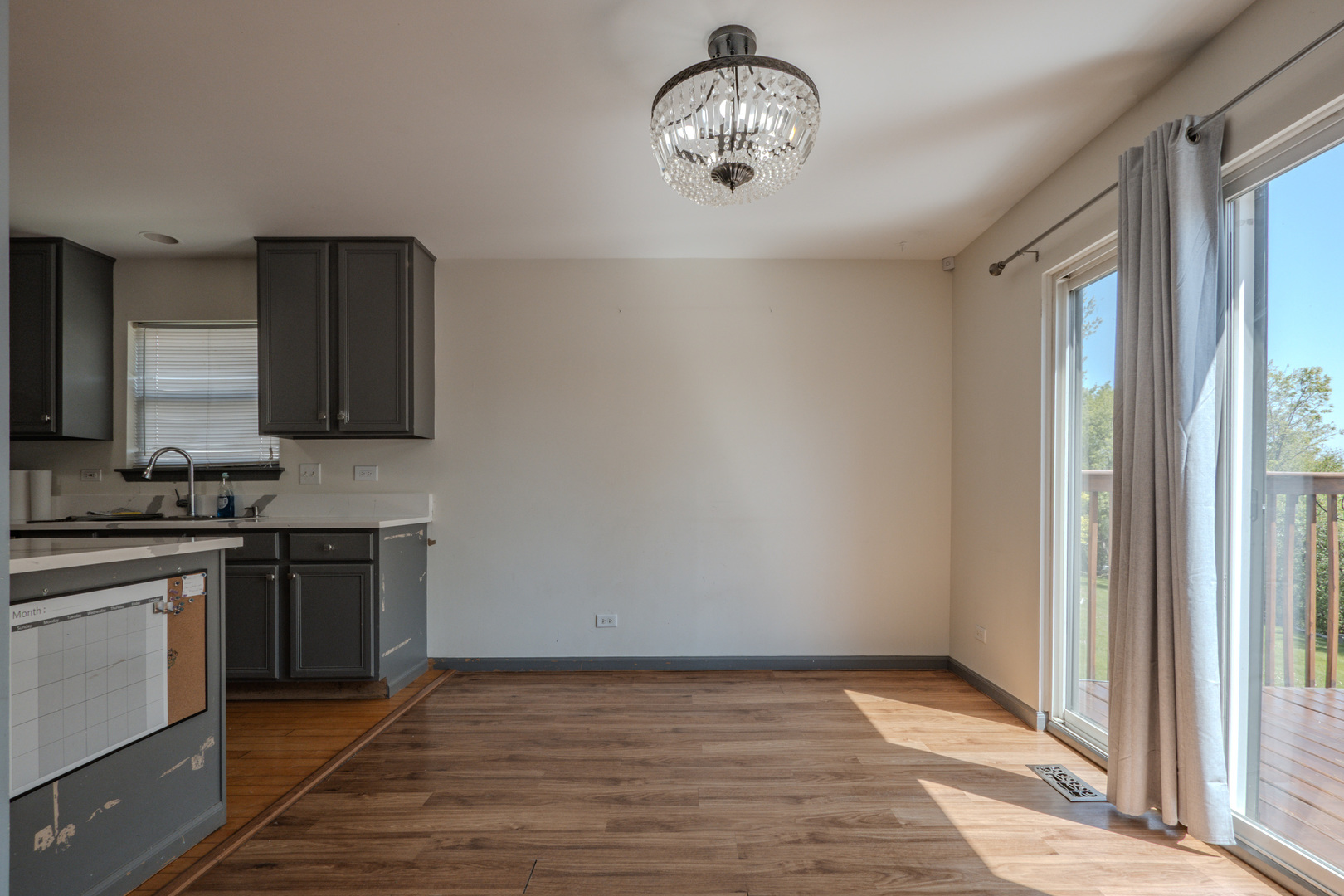 823 Park Bluff Circle Elgin, IL 60120 - Photo 4 of 20 a view of a kitchen with a stove wooden floor and a kitchen space