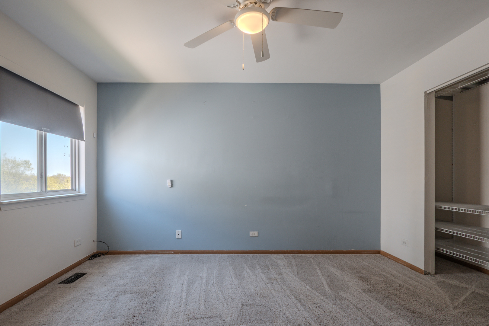 823 Park Bluff Circle Elgin, IL 60120 - Photo 8 of 20 an empty room with closet and window