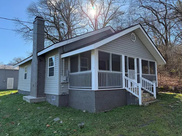 a view of backyard with a garden and deck