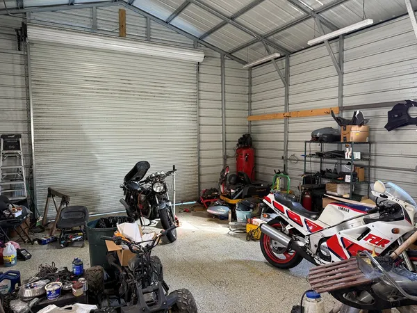 a view of a garage with parked cars