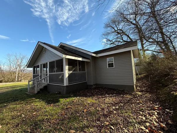a house with trees in the background