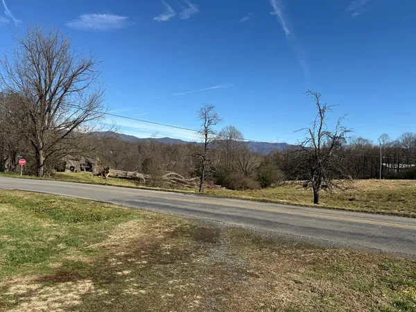 a view of a town with mountains in the background