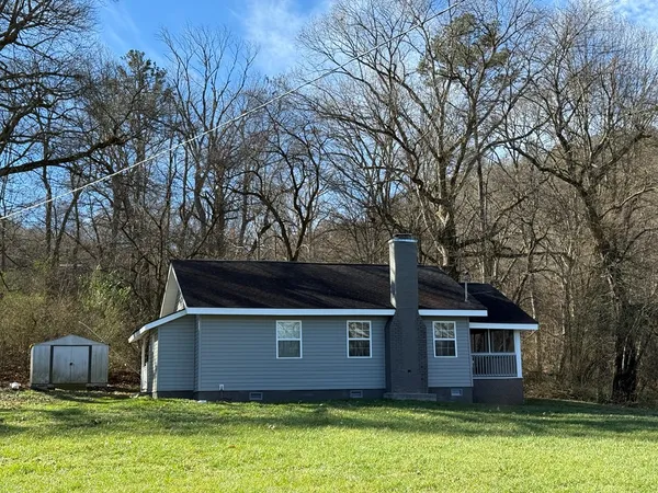 front view of a house with a yard