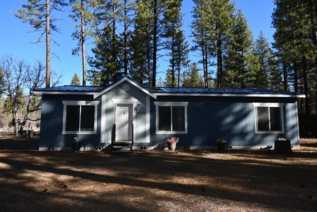 a front view of a house with yard