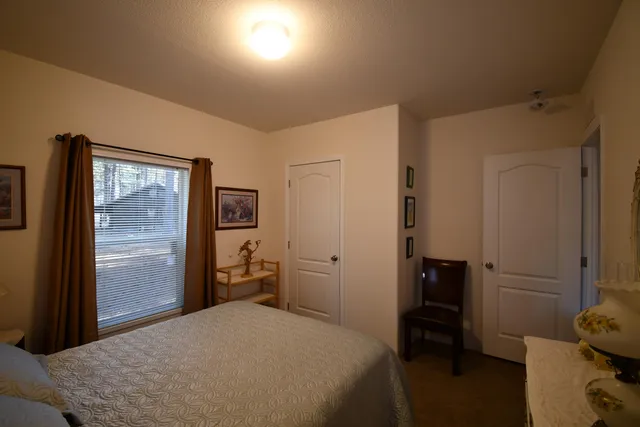 a bedroom with a bed and furniture