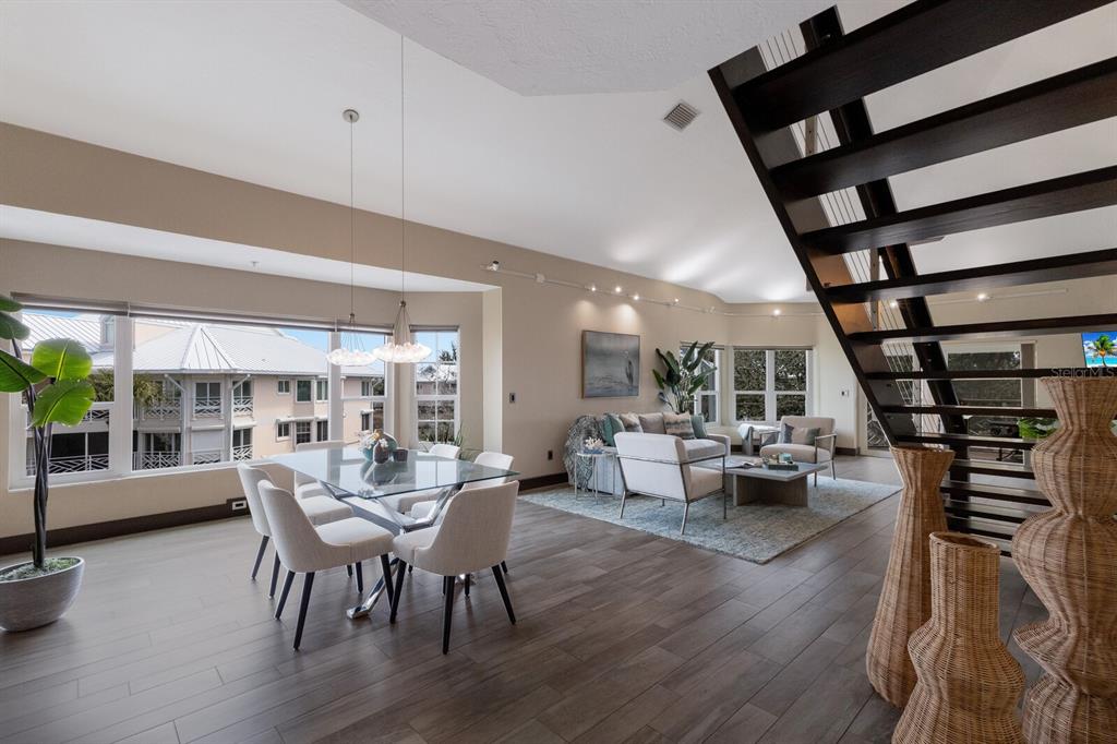 11000 Placida Road, Unit 2203 Placida, FL 33946 - Photo 12 of 64 a view of a dining room with furniture window and wooden floor