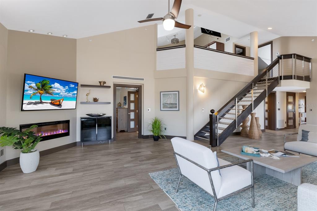 11000 Placida Road, Unit 2203 Placida, FL 33946 - Photo 14 of 64 a living room with furniture and a flat screen tv