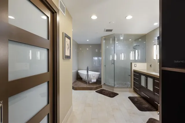a bathroom with a double vanity sink and a mirror