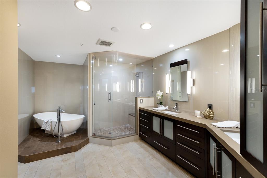 11000 Placida Road, Unit 2203 Placida, FL 33946 - Photo 18 of 64 a bathroom with a double vanity sink and a mirror