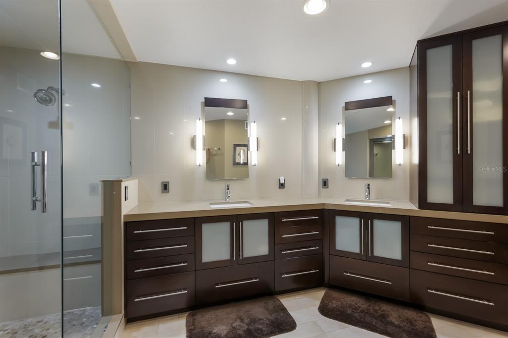 11000 Placida Road, Unit 2203 Placida, FL 33946 - Photo 19 of 64 a bathroom with a sink and a mirror