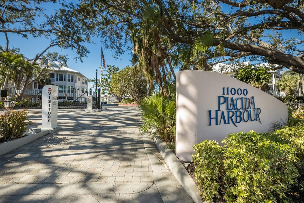 11000 Placida Road, Unit 2203 Placida, FL 33946 - Photo 2 of 64 a sign board with yard