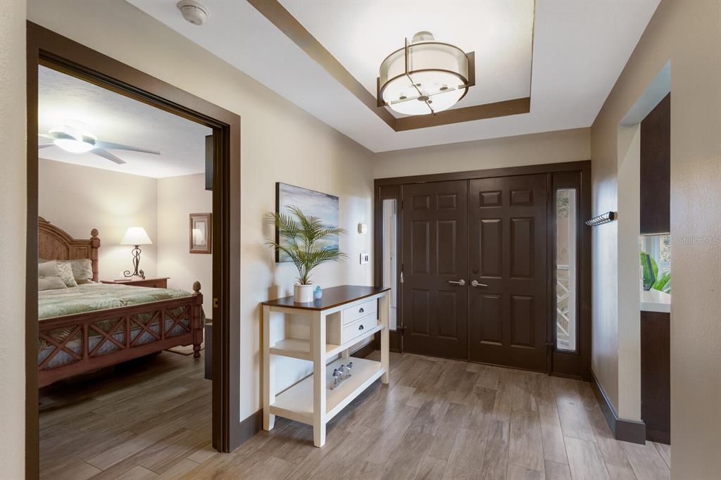 11000 Placida Road, Unit 2203 Placida, FL 33946 - Photo 21 of 64 a bedroom with a bed and a mirror