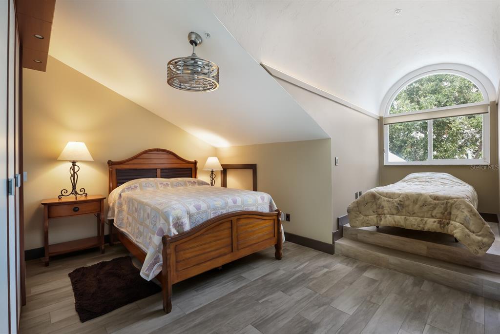 11000 Placida Road, Unit 2203 Placida, FL 33946 - Photo 31 of 64 a bedroom with a bed and a window