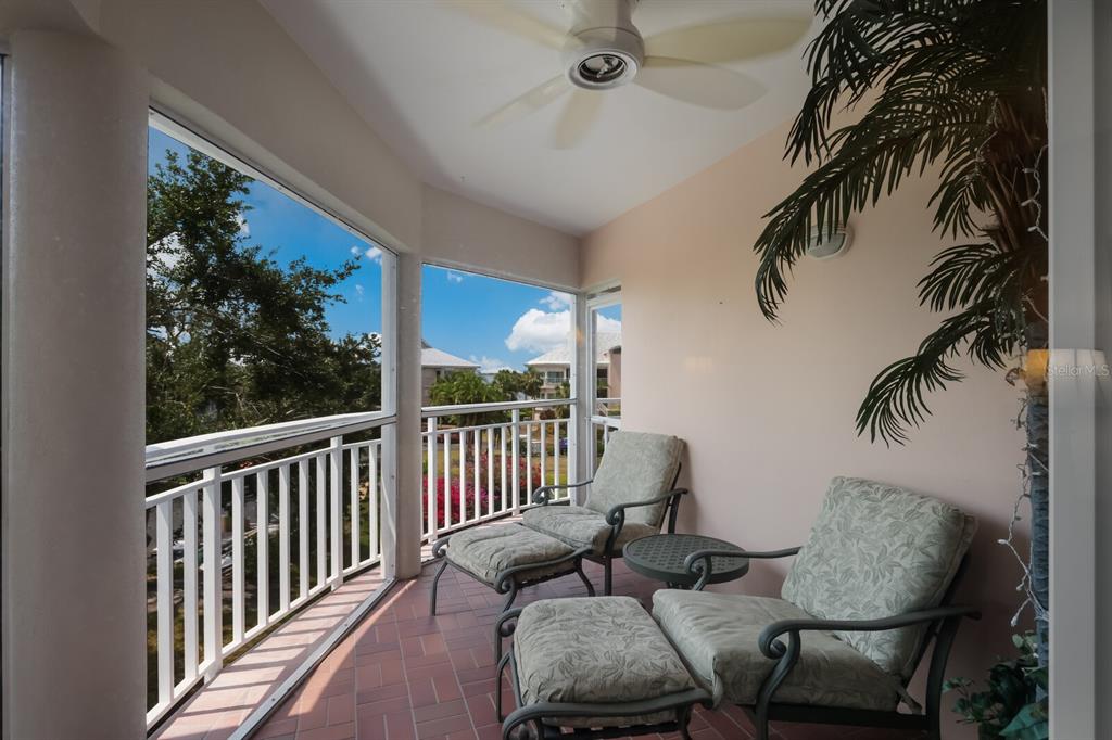 11000 Placida Road, Unit 2203 Placida, FL 33946 - Photo 34 of 64 a view of a chairs and table in patio