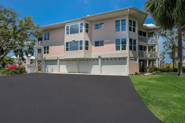 a view of a swimming pool with outdoor seating