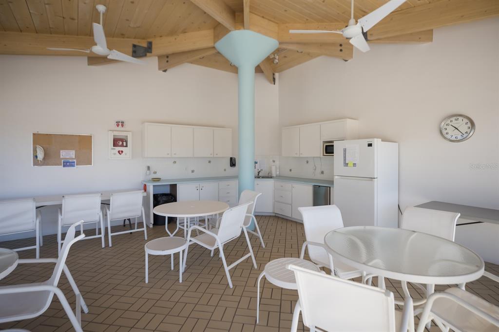 11000 Placida Road, Unit 2203 Placida, FL 33946 - Photo 40 of 64 a dining room with furniture and wooden floor