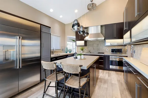 a kitchen with a sink and cabinets