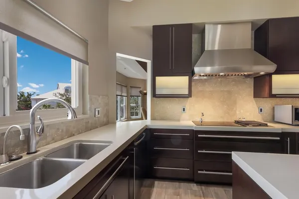 a kitchen with a sink and a microwave