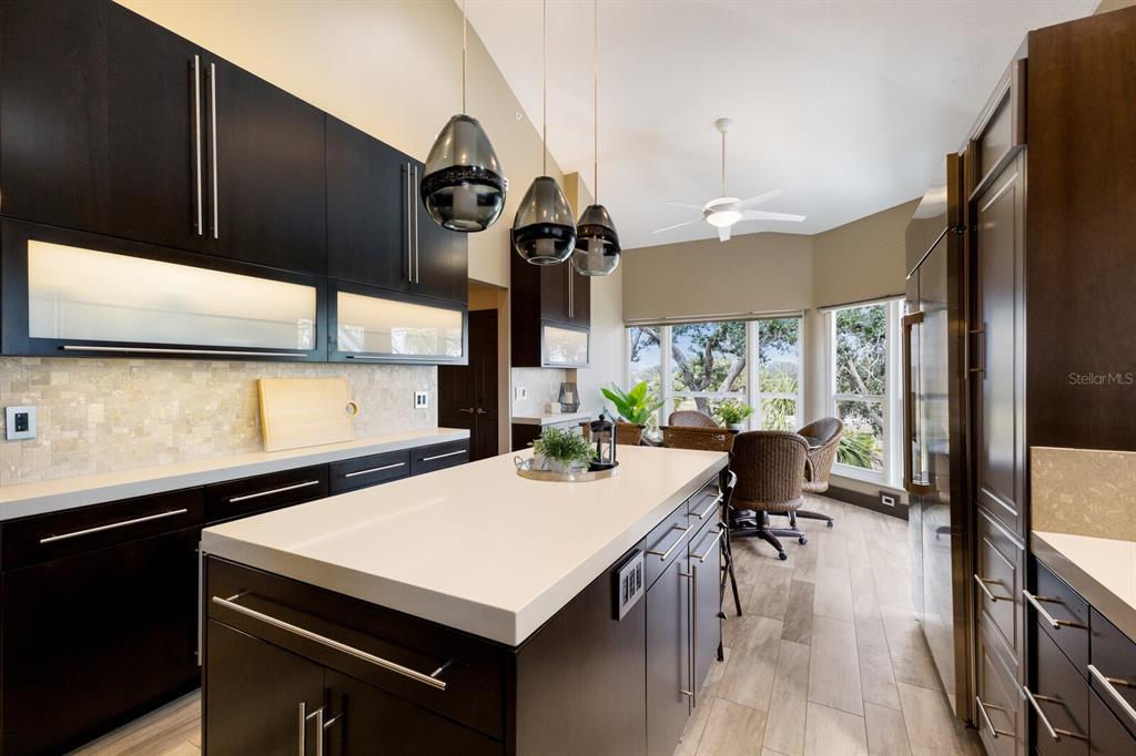 11000 Placida Road, Unit 2203 Placida, FL 33946 - Photo 5 of 64 a kitchen with a sink a stove and a refrigerator