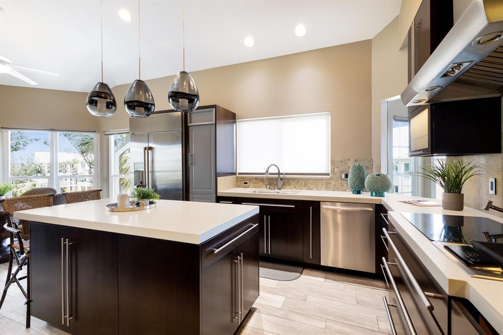 11000 Placida Road, Unit 2203 Placida, FL 33946 - Photo 7 of 64 a kitchen with a sink a stove and kitchen island
