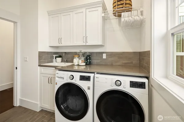 a utility room with dryer and washer
