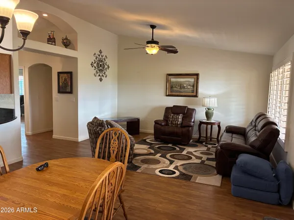 a living room with furniture a couch and a window