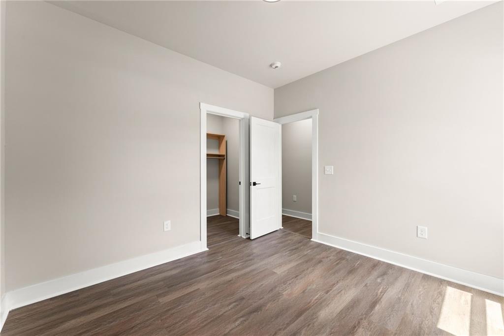 43 Anderson Street Jefferson, GA 30549 - Photo 27 of 45 a view of an empty room with wooden floor and closet