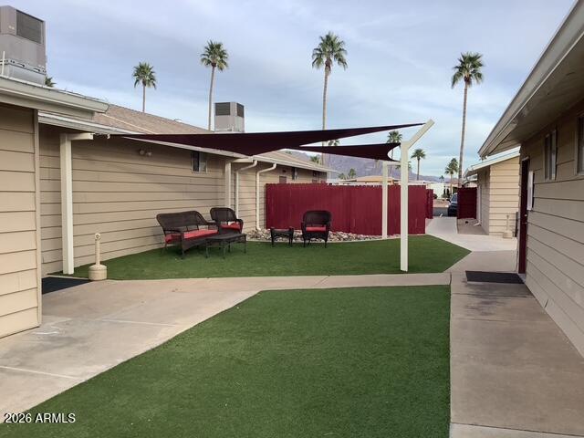 2605 South Tomahawk Road, Unit 10 Apache Junction, AZ 85119 - Photo 22 of 22 a front view of a house with a yard