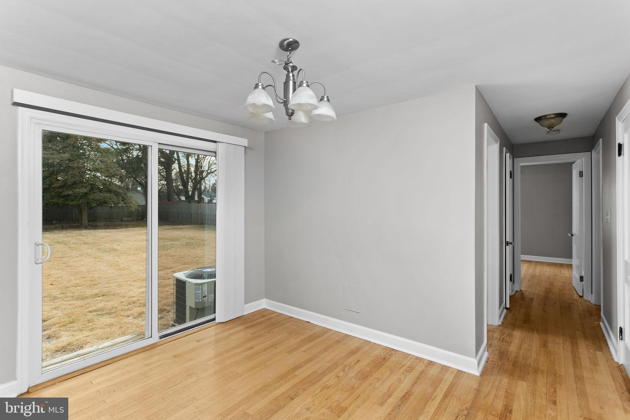 81 Wittenborn Avenue Hamilton, NJ 08619 - Photo 11 of 24 wooden floor in an empty room with a window